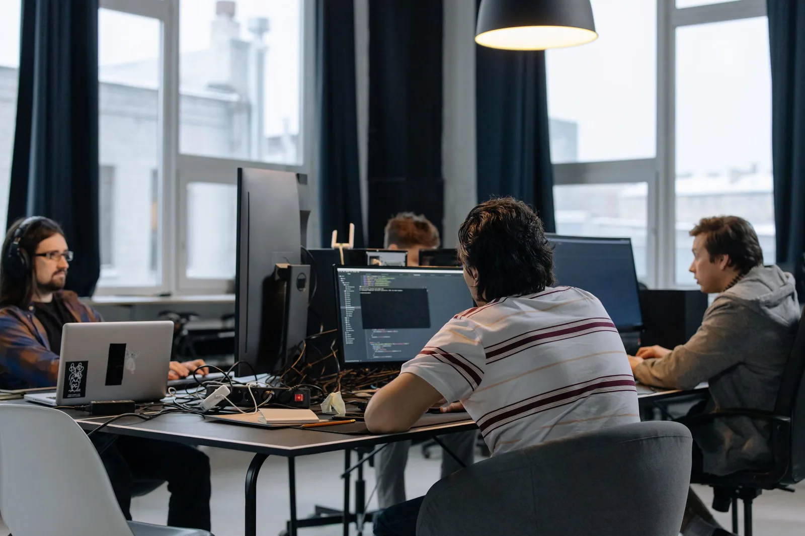 Team of developers working together in a modern tech office
